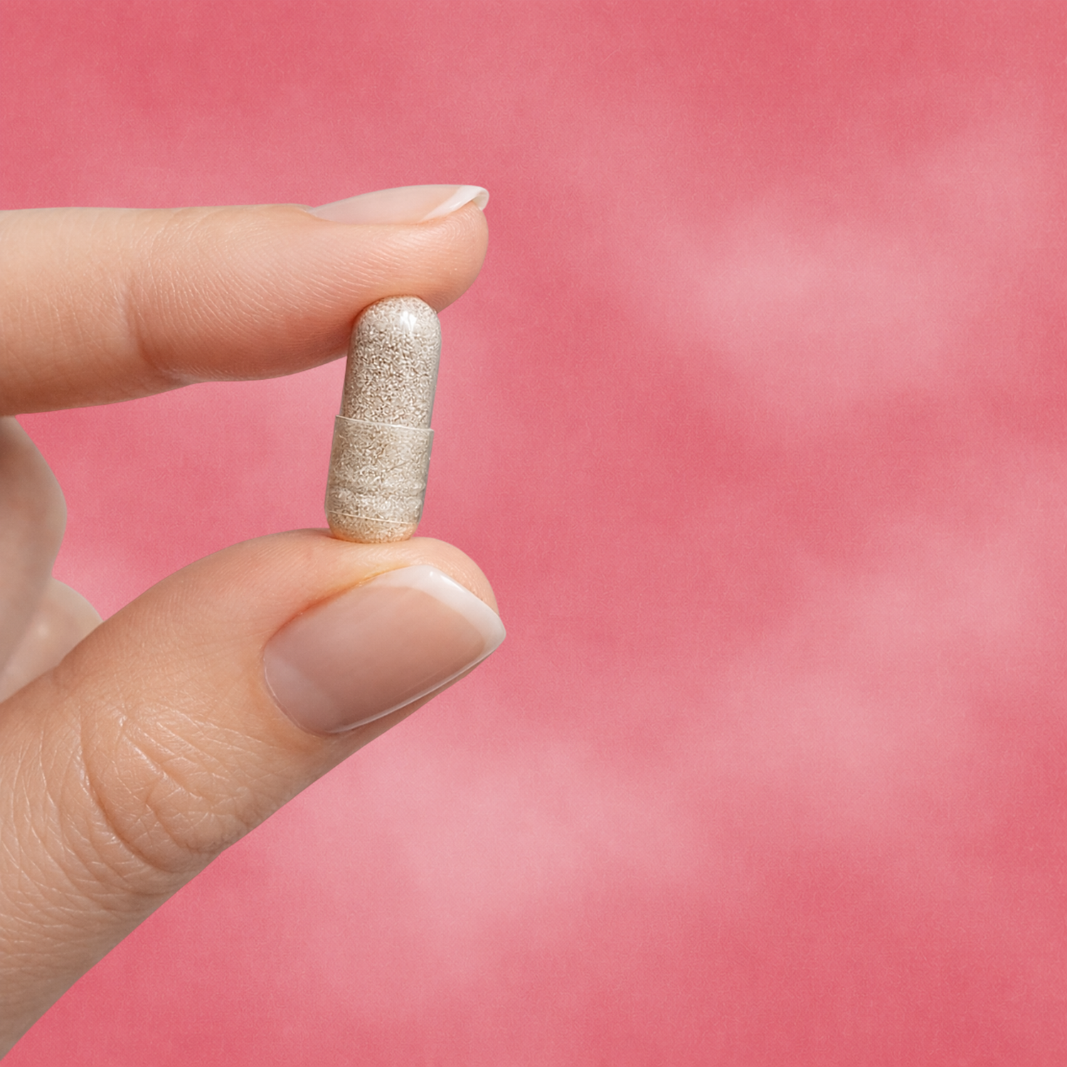women holding ashwagandha and rhodiola rosea capsule between finger tips