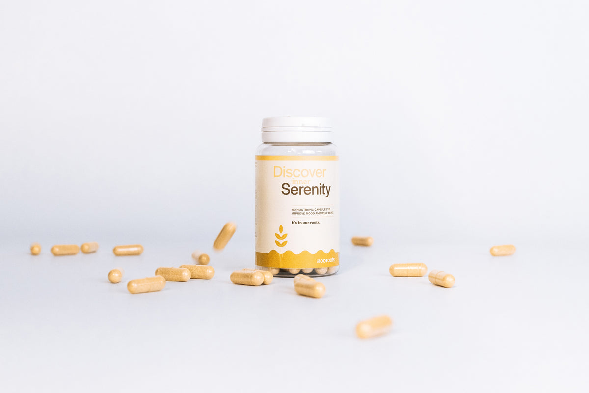 a bottle of nooroots mood nootropic supplements with capsules surrounding it