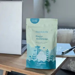 Learning & Memory pouch on a desk by a laptop
