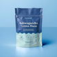 Blue pouch of Nooroots Ashwagandha + Lion’s Mane supplement on a blue background.