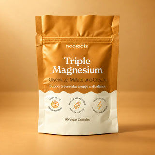 Nooroots Triple Magnesium pouch, 90 vegan capsules, on a warm amber studio background
